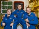 In the Integration Facility at the Baikonur Cosmodrome in Kazakhstan, Expedition 58 crew members (L – R) Anne McClain, Oleg Kononenko, RN3DX, and David Saint-Jacques, KG5FYI. [NASA photo by Victor Zelentsov]